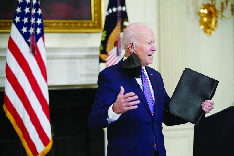 WASHINGTON: US President Joe Biden speaks to reporters after talking about the March jobs report in the State Dining Room of the White House on April 2, 2021. - AFP n