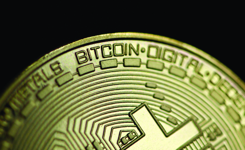 DORTMUND: In this file photo taken on Jan 26, 2020, a physical imitation of a bitcoin is pictured. - AFP n