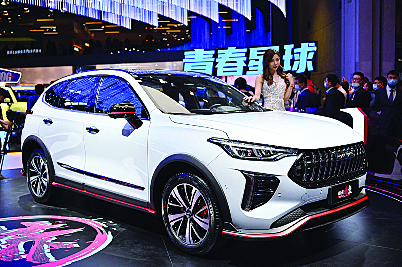 SHANGHAI: A Haval HEV car is seen during the 19th Shanghai International Automobile Industry Exhibition yesterday. - AFP n
