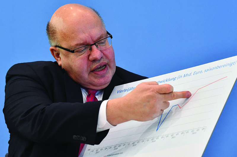 BERLIN: German Economy Minister Peter Altmaier comments on a graph during a press conference to present the German government's economic spring projection yesterday. - AFP n