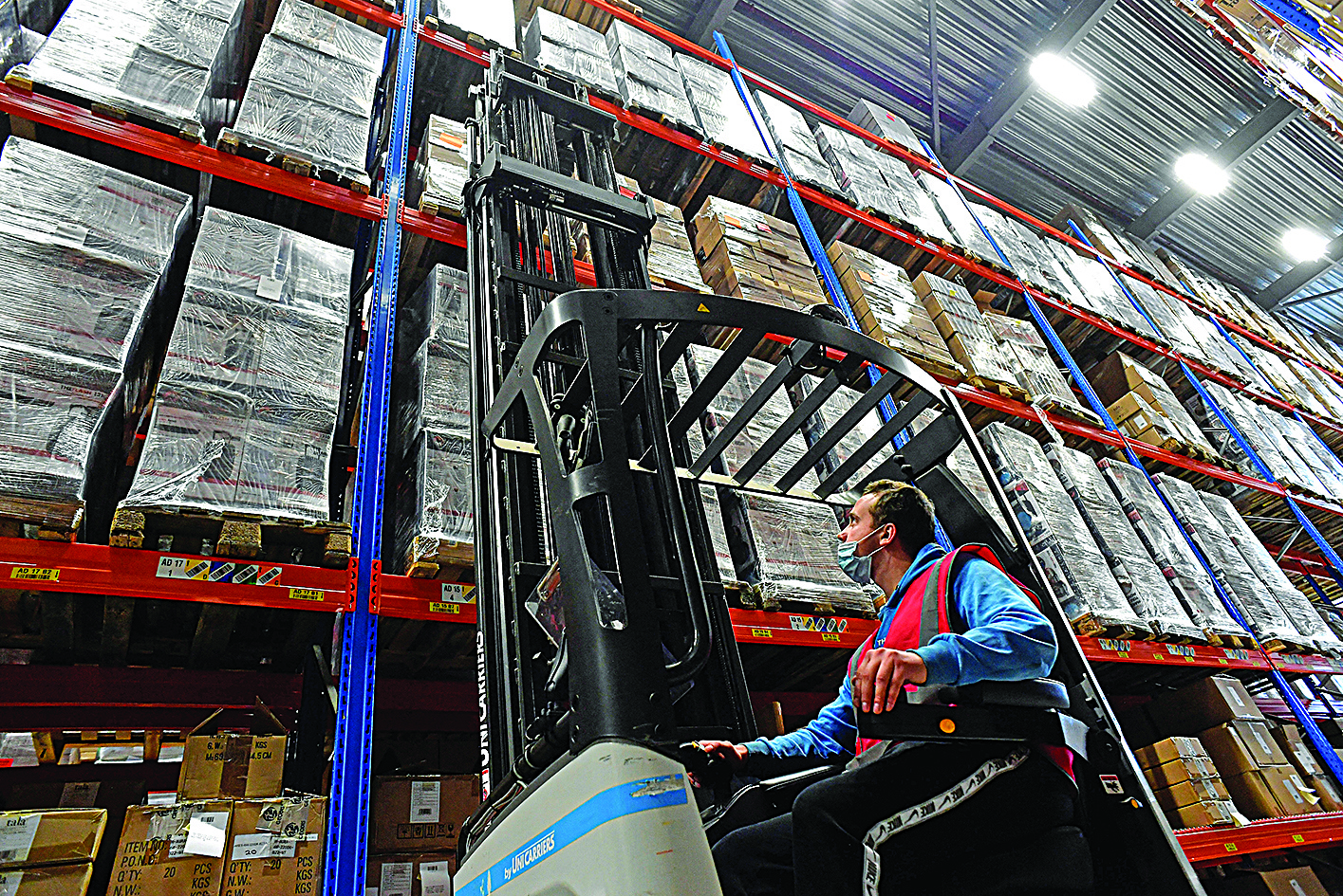 An employee works at the Seko Logistics and warehousing company as the demand for warehousing has surged in the Netherlands since the United Kingdom departed the European Union in 2020 known as Brexit, in Schiphol. - AFPn