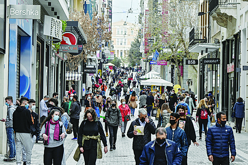 ATHENS: People walk down Athens main commercial street on the first day of the reopening of retail stores yesterday amid the coronavirus pandemic. – AFPn