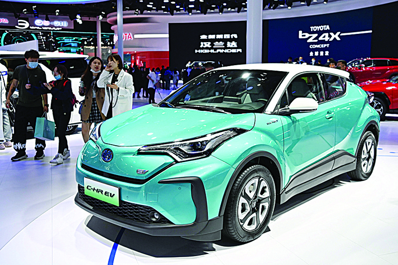 A Toyota C-HR EV electric car is seen during the 19th Shanghai International Automobile Industry Exhibition in Shanghai on April 19, 2021. (Photo by Hector RETAMAL / AFP)