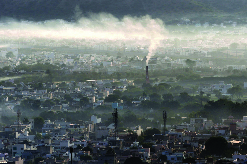 AJMER, India: In this file photograph taken on Nov 2, 2020, smoke billows from a factory chimney during a smoggy morning. - AFP n