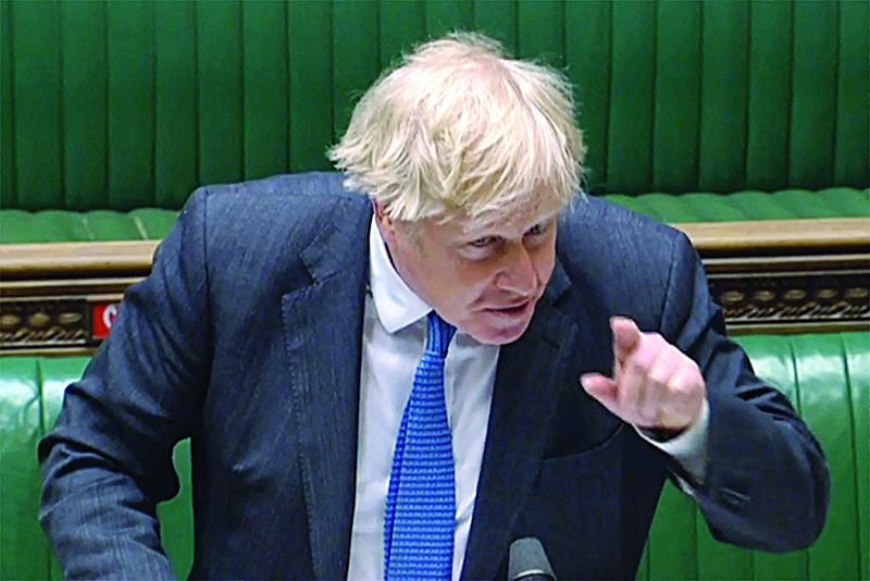 LONDON: A video grab from footage broadcast by the UK Parliament's Parliamentary Recording Unit (PRU) shows Britain's Prime Minister Boris Johnson taking part in the weekly Prime Minister's Questions (PMQs) at the House of Commons in London yesterday.-AFPn