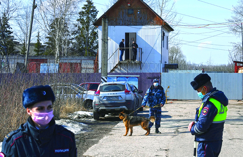 POKROV, Russia: Russian police officers guard the entrance to the penal colony N2, where Kremlin critic Alexei Navalny has been transferred to serve a two-and-a-half year prison term for violating parole, in the town of Pokrov yesterday.-AFPn