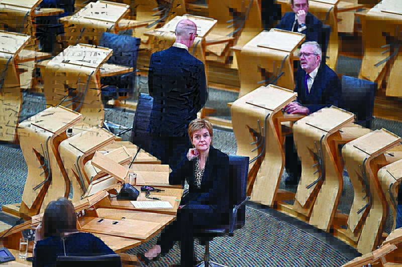 EDINBURGH: Scotland's First Minister Nicola Sturgeon joins Scottish political party leaders as they take part in a motion of condolence following the death of Britain's Prince Philip, Duke of Edinburgh, at the Scottish Parliament Building in Edinburgh yesterday.-AFPn