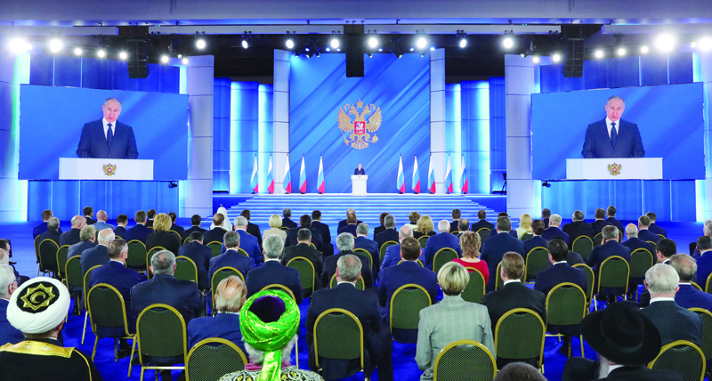 MOSCOW: Russian President Vladimir Putin delivers his annual state of the nation address at the Federal Assembly at the Manezh Exhibition Hall yesterday. - AFPn
