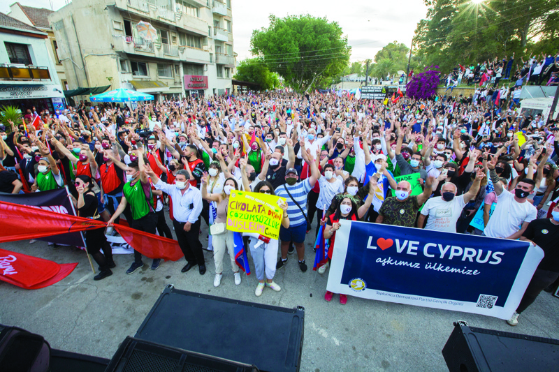 NICOSIA: Cypriot demonstrators gesture during a rally in the capital Nicosia, on the Turkish-speaking side in the self-proclaimed Turkish Republic of North Cyprus (TRNC) of the divided island, Saturday.-AFPn