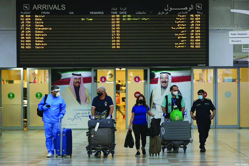 KUWAIT: In this August 1, 2020 file photo, passengers arrive at Kuwait international Airport. Kuwait's Civil Aviation Authority yesterday suspended direct commercial flights with India at the recommendation of health authorities. - Photo by Yasser Al-Zayyatn
