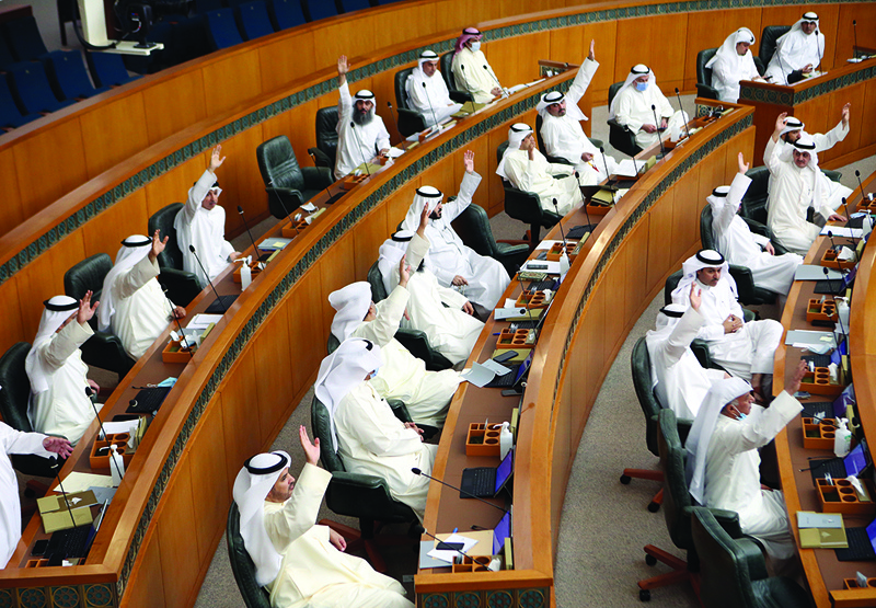 KUWAIT: MPs react during the session in the National Assembly yesterday. – Photo by Yasser Al-Zayyatnn