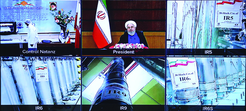 A screen grab from a videoconference shows views of centrifuges and devices at Iran's Natanz uranium enrichment plant, as well as Iranian President Hassan Rouhani delivering a speech yesterday. - AFP n