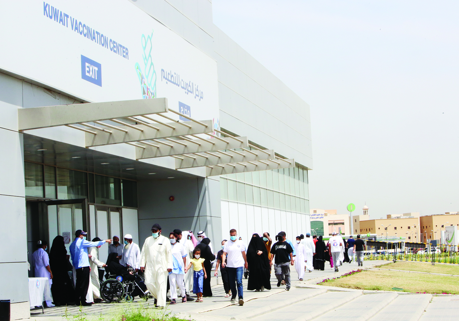 KUWAIT: People arrive to receive a dose of COVID-19 coronavirus vaccine at the make-shift vaccination center at the Kuwait International Fairground in Mishref yesterday. - Photo by Yasser Al-Zayyatn