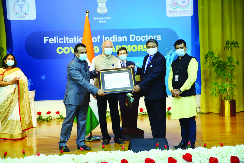 KUWAIT: Indian Ambassador Sibi George presents a memento to Indian Doctors Forum officials during a felicitation ceremony at the Indian embassy Saturday. n