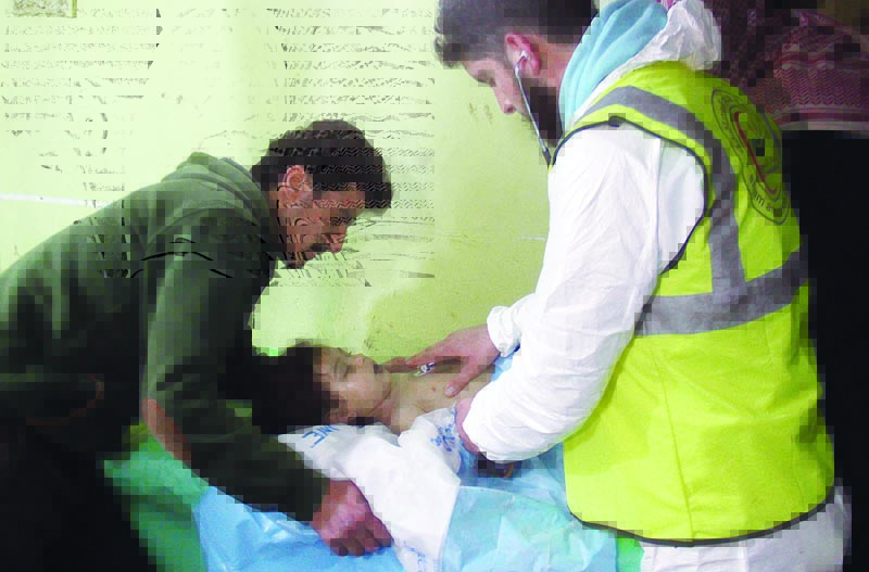 In this file photo taken on April 04, 2017 an unconscious Syrian child receives treatment at a hospital in Khan Sheikhun, a rebel-held town in the northwestern Syrian Idlib province, following a suspected toxic gas attack. -- AFPn