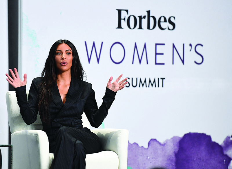 In this file photo Kim Kardashian speaks with Steve Forbes at the 2017 Forbes Women's Summit at Spring Studios in New York City.-AFP photosn