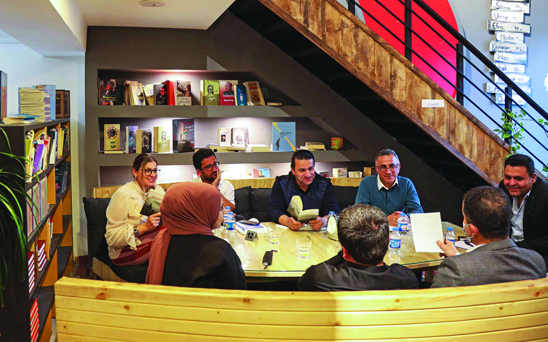 Members of a book club meet to review a novel at a book store in Arbil, the capital of the autonomous Kurdish region of northern Iraq.-AFP photosn