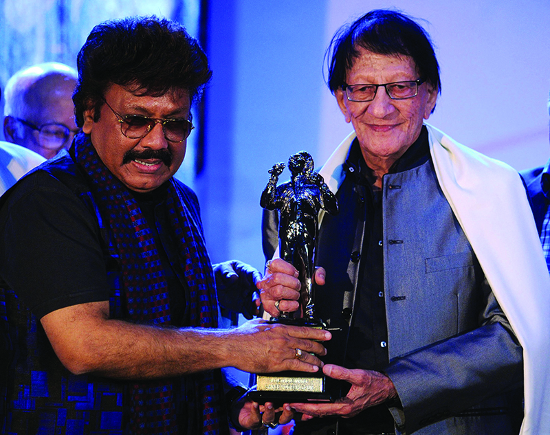 In this file photo Bollywood music director/composer Shravan Rathod (left) and writer/lyricist Yogesh Gaur pose for a photograph during the Ravindra Jain Academy Awards ceremony in Mumbai.-AFP n