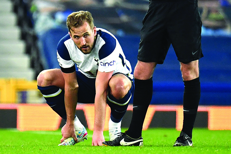 LIVERPOOL: Tottenham Hotspur’s English striker Harry Kane holds his foot before leaving the pitch injured during the English Premier League football match between Everton and Tottenham Hotspur at Goodison Park in Liverpool, north west England on Friday. — AFP