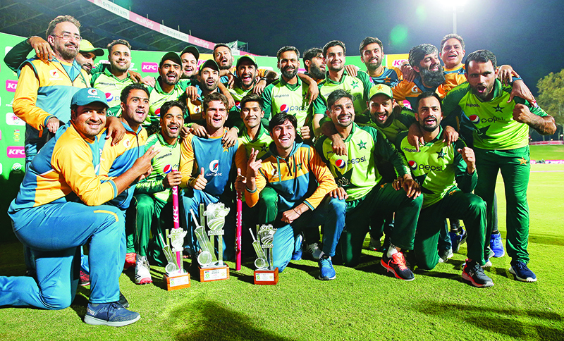 CENTURION: Pakistan players and support staff celebrate their series victory after the fourth Twenty20 international cricket match between South Africa and Pakistan at SuperSport Park in Centurion on Friday. — AFP