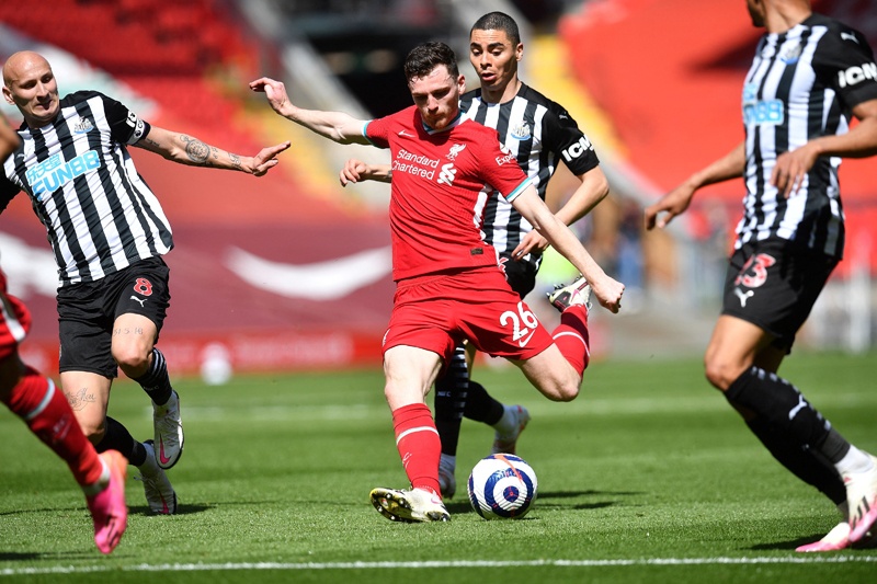 LIVERPOOL: Liverpool's Scottish defender Andrew Robertson shoots but fails to score during the English Premier League football match between Liverpool and Newcastle United at Anfield yesterday. - AFP n