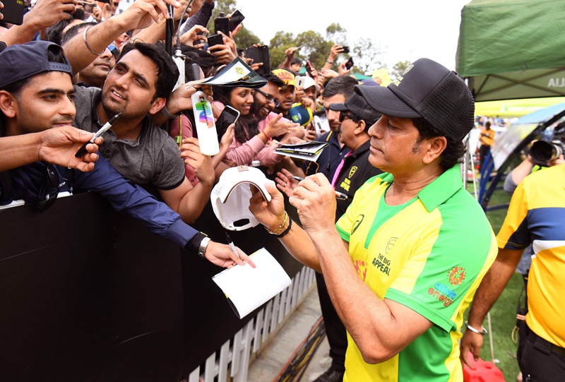 MELBOURNE: In this file photo taken on Feb 9, 2020, former Indian player Sachin Tendulkar signs autographs during a celebrity cricket match to raise funds for people affected by the Australian bushfires. – AFP n