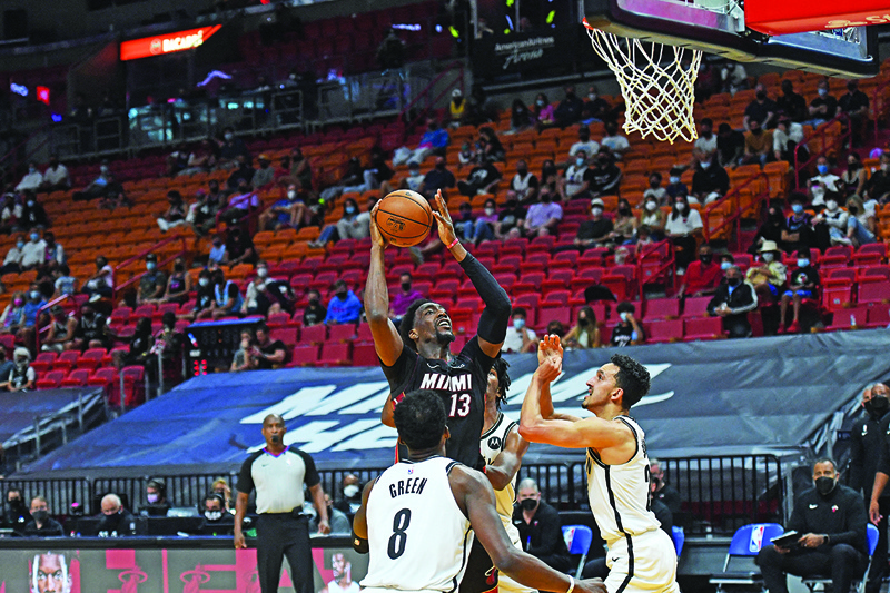 MIAMI: Bam Adebayo #13 of the Miami Heat shoots the ball against the Brooklyn Nets on Sunday at American Airlines Arena. - AFP n