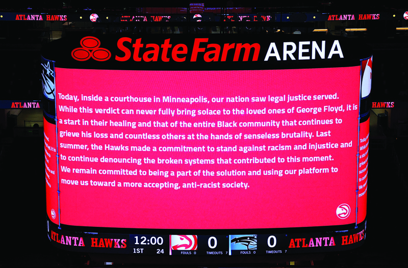ATLANTA: The Atlanta Hawks and Orlando Magic observe the guilty verdicts in the Derek Chauvin case prior to the game at State Farm Arena on Tuesday in Atlanta, Georgia. - AFPn