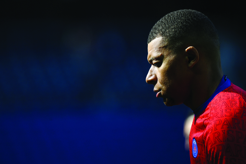 PARIS: Paris Saint-Germain's French forward Kylian Mbappe warms up prior to the French L1 football match between Paris-Saint Germain (PSG) and Lille (LOSC) at the Parc des Princes Stadium in Paris, on Saturday. - AFPn
