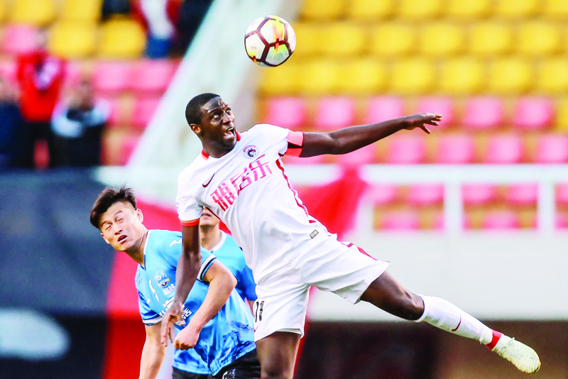 DALIAN, China: This photo taken on Oct 7, 2018 shows Jacob Mulenga (right) of Liaoning Hongyun FC heading the ball during the China League One football match between Dalian Transcendence FC and Liaoning Hongyun FC. - AFP n