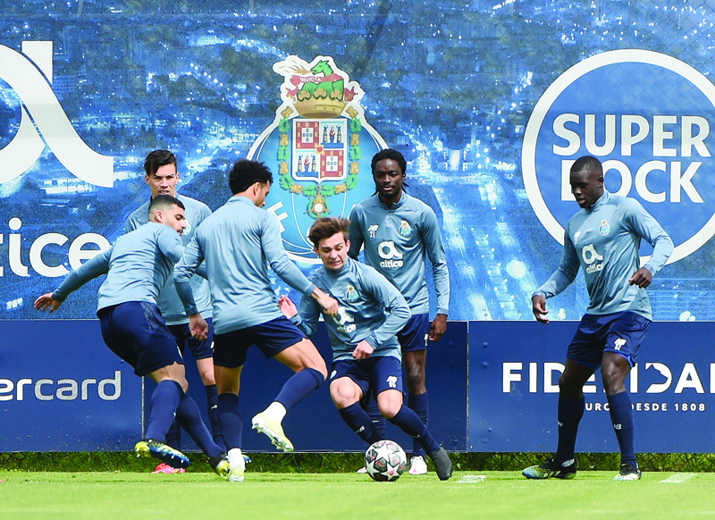 VILA NOVA DE GAIA: FC Porto's players attend a training session at the club's training ground of Olival, in Vila Nova de Gaia yesterday, on the eve of the UEFA Champions League quarter final second leg football match between FC Porto and Chelsea. - AFPn