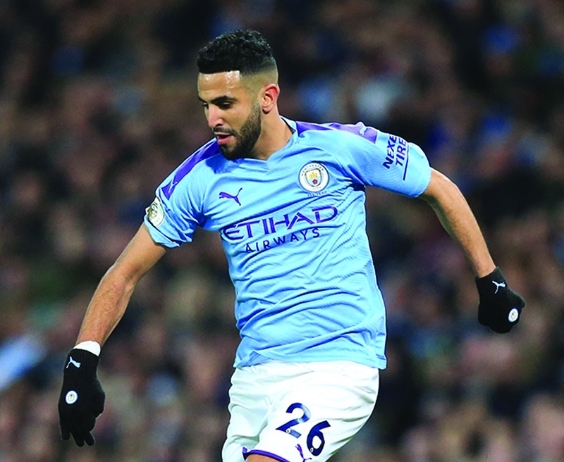 MANCHESTER: In this file photo taken on December 29, 2019 Manchester City's Algerian midfielder Riyad Mahrez controls the ball during the English Premier League football match between Manchester City and Sheffield United at the Etihad Stadium in Manchester, north west England. - AFPn