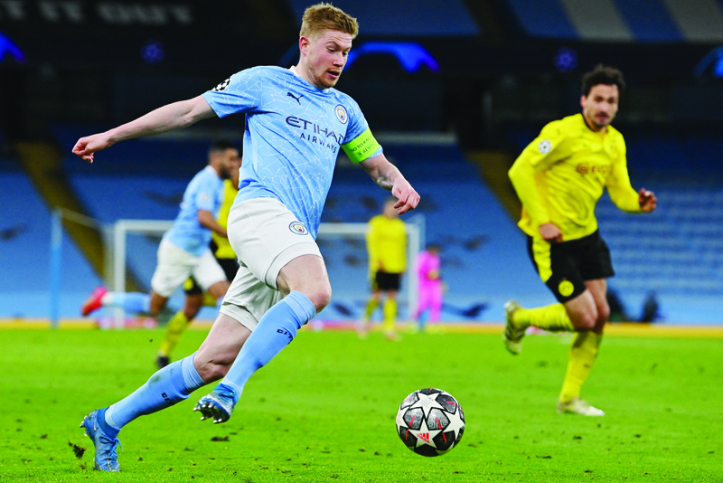 MANCHESTER: Manchester City's Belgian midfielder Kevin De Bruyne runs with the ball during the UEFA Champions League first leg quarter-final football match between Manchester City and Borussia Dortmund at the Etihad Stadium in Manchester, north west England, on Tuesday. - AFPn