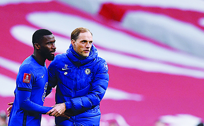 LONDON: Chelsea's German head coach Thomas Tuchel (right) celebrates with Chelsea's German defender Antonio Rudiger after the English FA Cup semi-final football match between Chelsea and Manchester City at Wembley Stadium in north west London on Saturday. - AFPn
