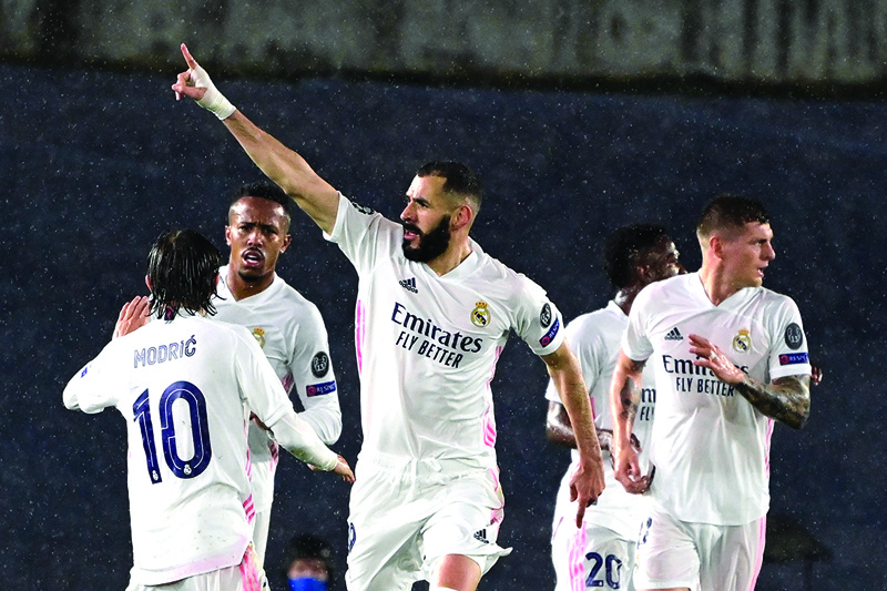 MADRID: Real Madrid's French forward Karim Benzema celebrates after scoring during the UEFA Champions League semi-final first leg football match between Real Madrid and Chelsea at the Alfredo di Stefano stadium in Valdebebas, on the outskirts of Madrid, on Tuesday. - AFP n