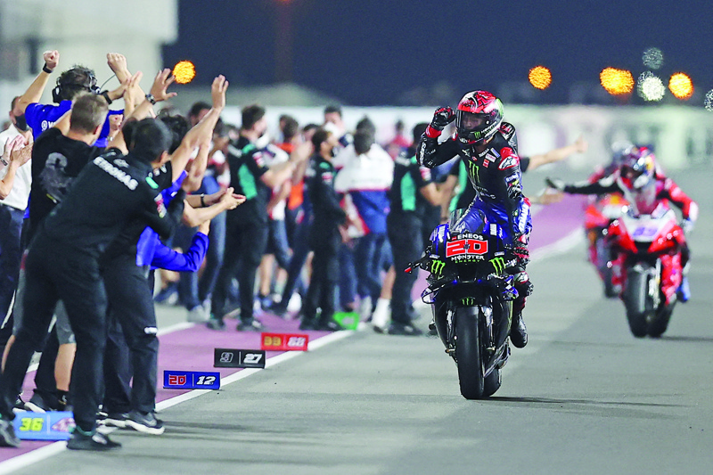 LUSAIL: Monster Energy Yamaha MotoGP's French rider Fabio Quartararo celebrates after winning the Moto GP Grand Prix of Doha at the Losail International Circuit, in the city of Lusail on Sunday. - AFPn