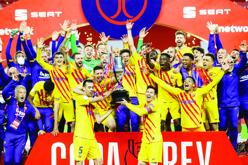 SEVILLE: A handout picture released by the Spanish Football Federation (RFEF) shows Barcelona's players celebrating with the trophy at the end of the Spanish Copa del Rey (King's Cup) final football match between Athletic Club Bilbao and FC Barcelona at La Cartuja stadium in Seville on Saturday. - AFP n