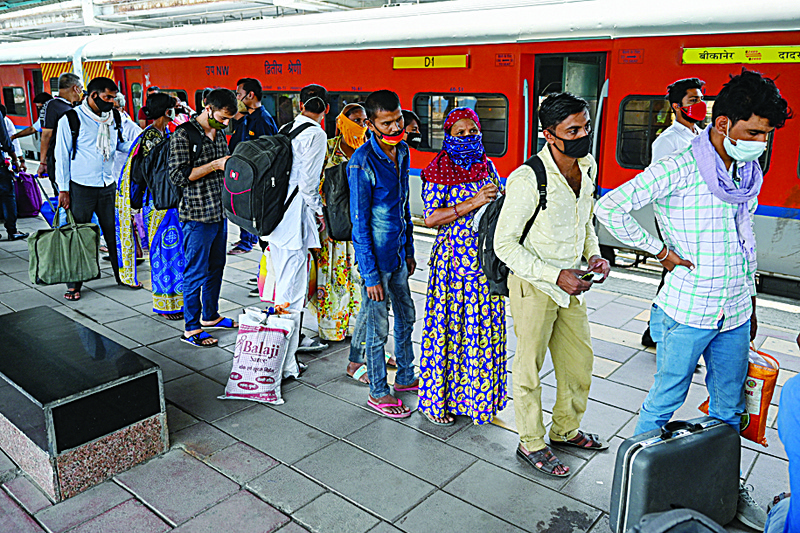 MUMBAI: Passengers queue up for the COVID-19 coronavirus medical screening after arriving at a railway platform on a long distance train.-AFPn