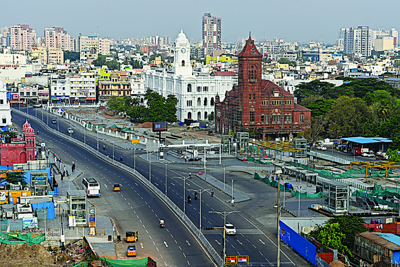 CHENNAI: A partially deserted road is seen during the Sunday lockdown imposed as a preventive measure against the spread of the CCOVID-19 coronavirus in Chennai yesterday.-AFPn