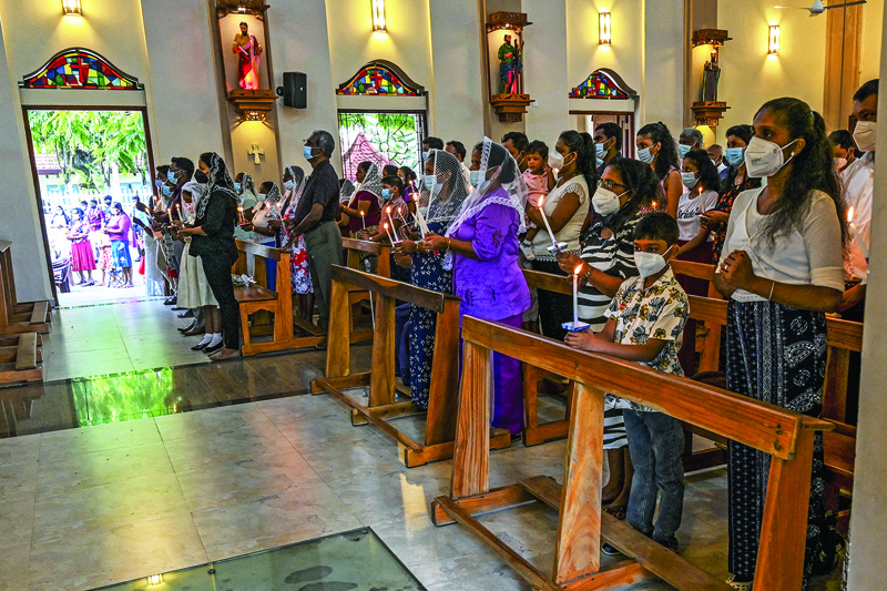Christian devotees attend an Easter mass at St Sebastian's Church in Katuwapitiya yesterday.-AFPn