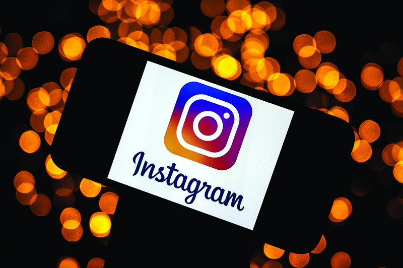 This file photograph shows the logo of the social network Instagram on a smartphone, in Toulouse, south-western France.n