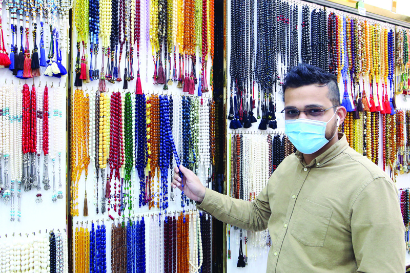 KUWAIT: A vendor displays prayer beads inside his shop at Mubarakiya Market in Kuwait City. - Photo by Yasser Al-Zayyatn
