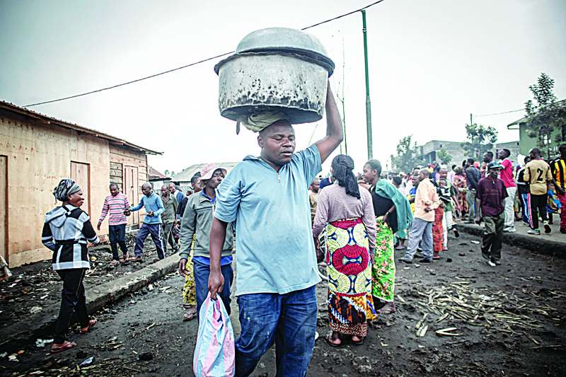 GOMA: Residents are seen gathering in a busy street after an eruption from Mount Nyiragongo in Goma in the East of the Democratic Republic of Congo. - AFPn