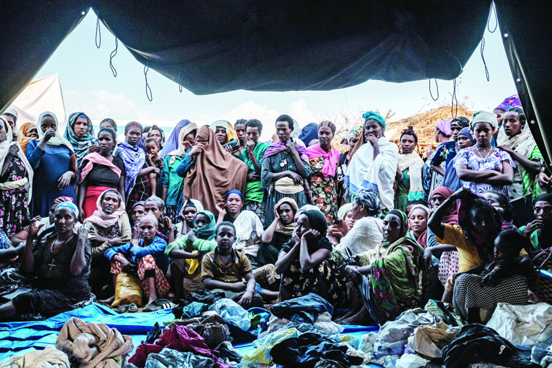 CHAGNI, Ethiopia: In this file photograph Internally Displaced People (IDP), fleeing from violence in the Metekel zone in Western Ethiopia, gather outside a tent where clothes are being distributed at a camp in Chagni, Ethiopia.-AFP n