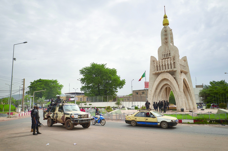 BAMAKO: Members of Mali's National Guard are seen at the Independence square in Bamako yesterday.-AFPn