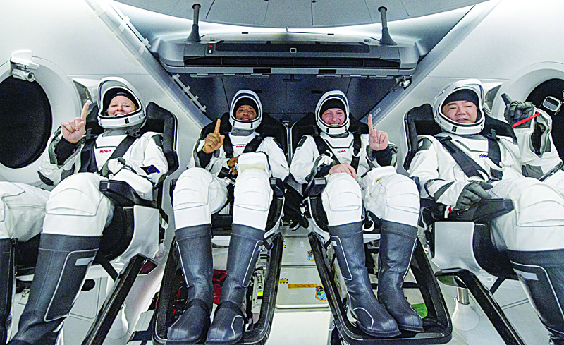 NASA astronauts from left:- Shannon Walker, Victor Glover, Mike Hopkins, and Japan Aerospace Exploration Agency (JAXA) astronaut Soichi Noguchi, strapped in their seats inside the SpaceX Crew Dragon Resilience spacecraft onboard the SpaceX GO Navigator recovery ship shortly after having landed in the Gulf of Mexico off the coast of Panama City yesterday. - AFPn