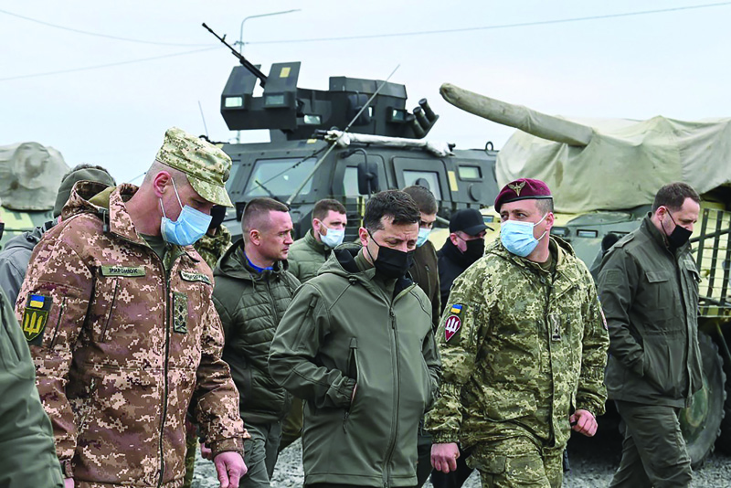KHERSON, Ukraine : This file picture shows Ukraine's President Volodymyr Zelensky (center) speaking with servicemen during his visit of Ukrainian army's outposts in the Kherson region, on the administrative border with Russia-annexed Crimea.-AFP n