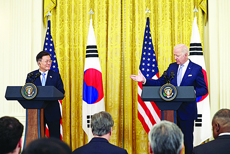 WASHINGTON: US President Joe Biden (right) and South Korean President Moon Jae-in participate in a joint press conference in the East Room of the White House in Washington, DC.-AFP n
