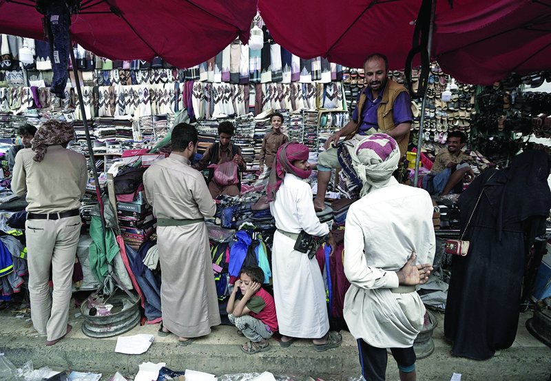 Yemenis gather at a market in Yemen's northeastern city of Marib.-AFP photosn