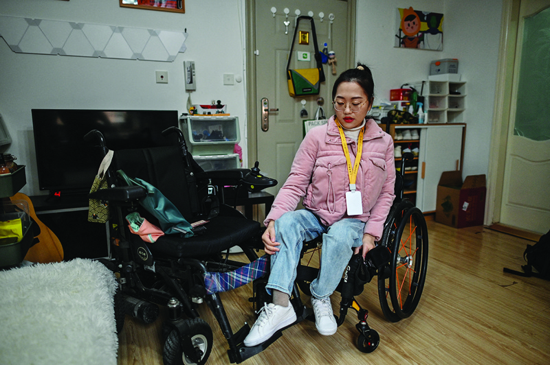 This photo shows video blogger Zhao Hongcheng at her apartment before going to work in Shanghai.-AFP photosn